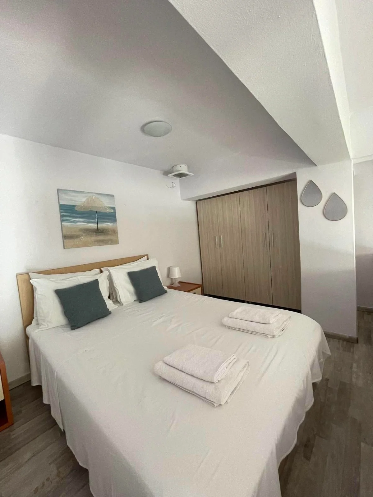 Real ALYSEA bedroom with double bed and white bedding
