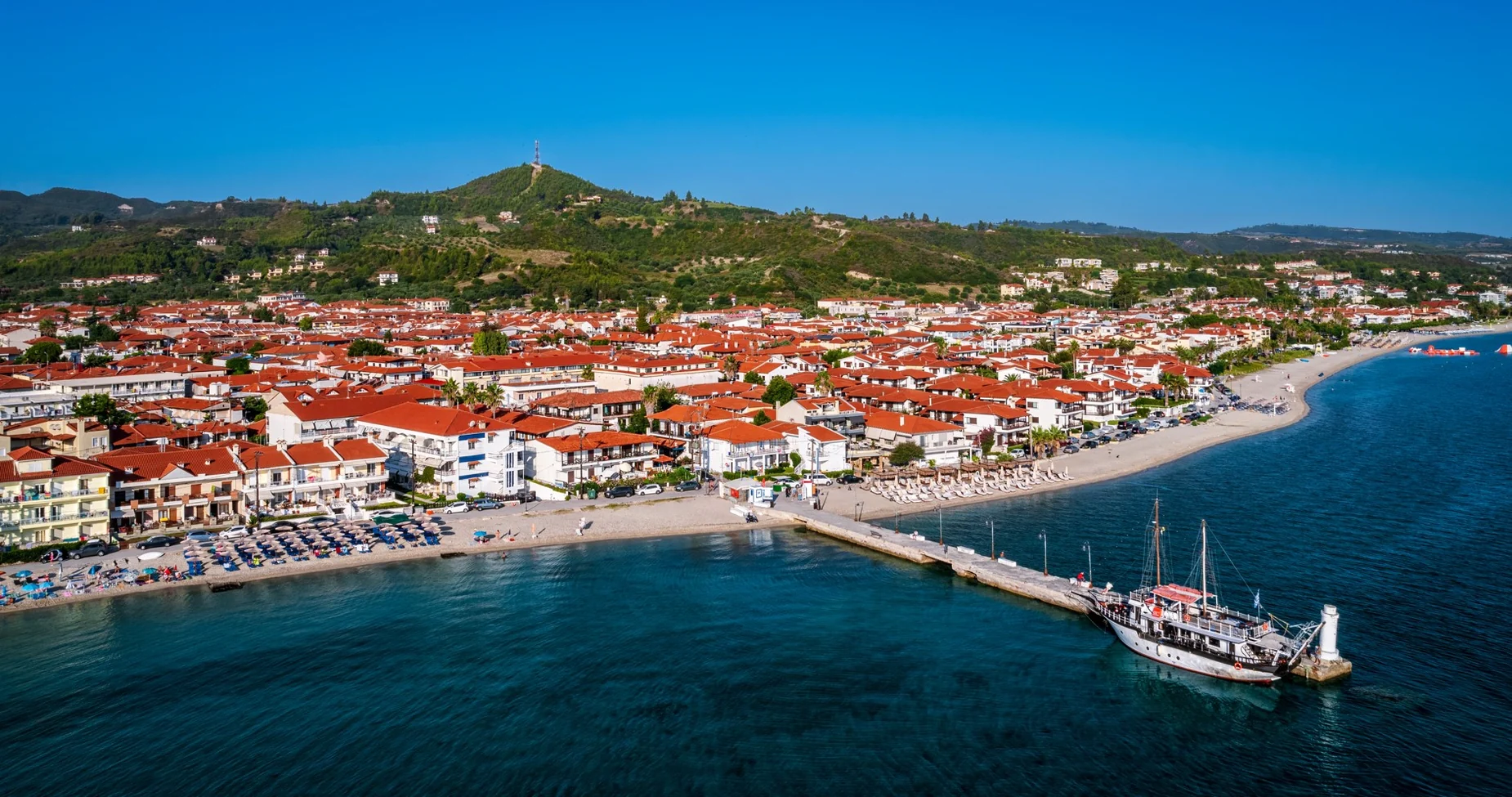 Aerial view of Pefkochori village, coastline and harbour