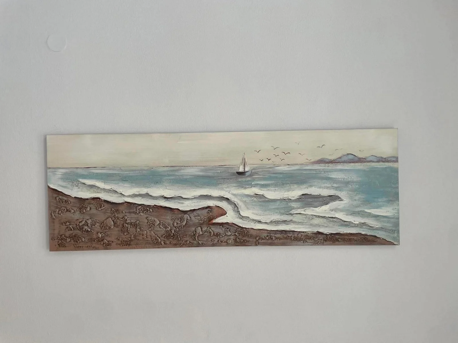 Original sea-inspired artwork displayed in the rooms
